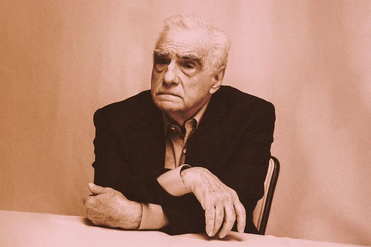 Portrait of Martin Scorsese leaning on a table