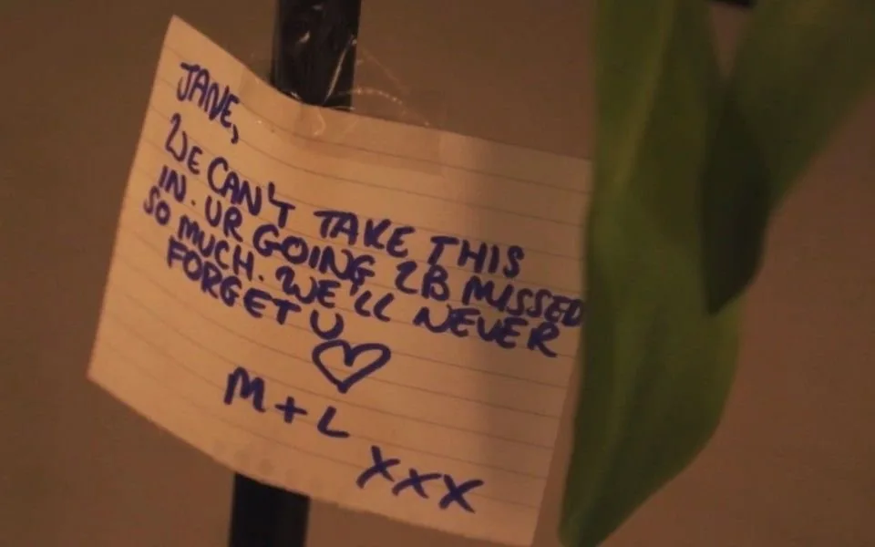 A handwritten note addressed to Jane among flowers