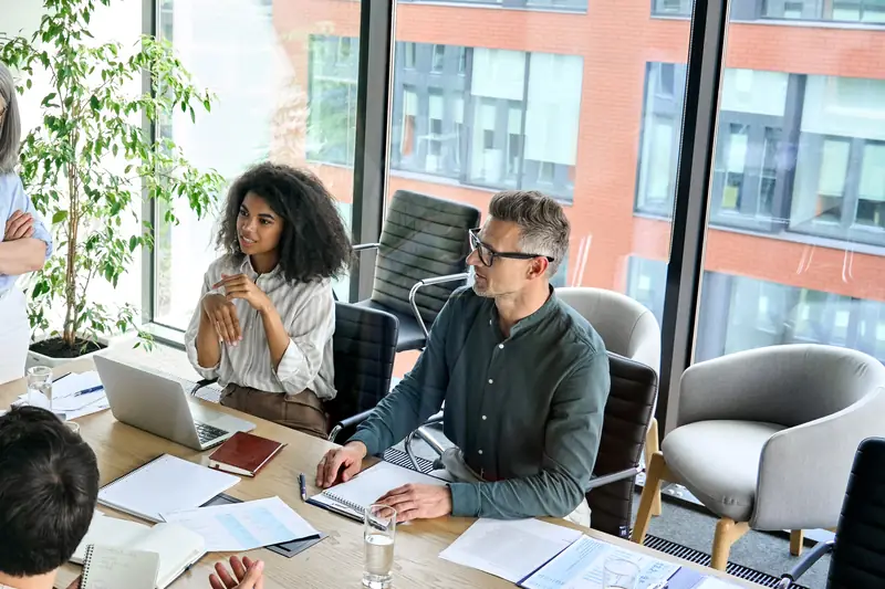 Colleagues around a boardroom table