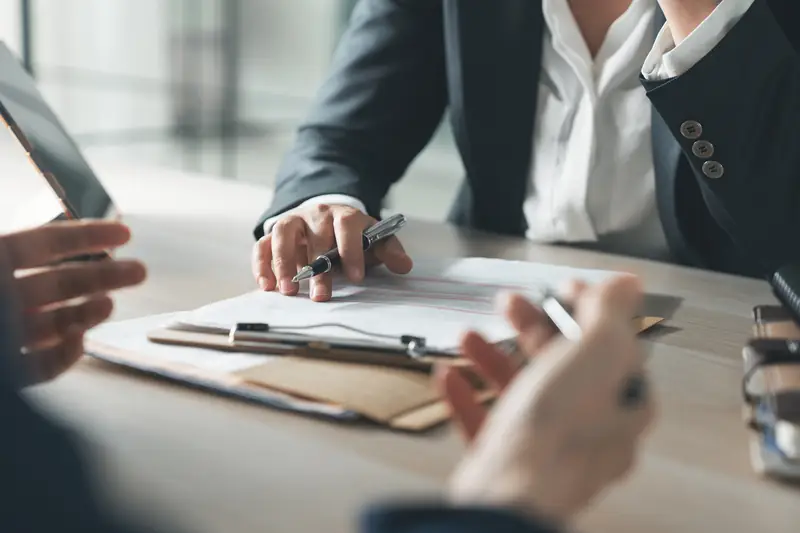 A contract on a desk being reviewed