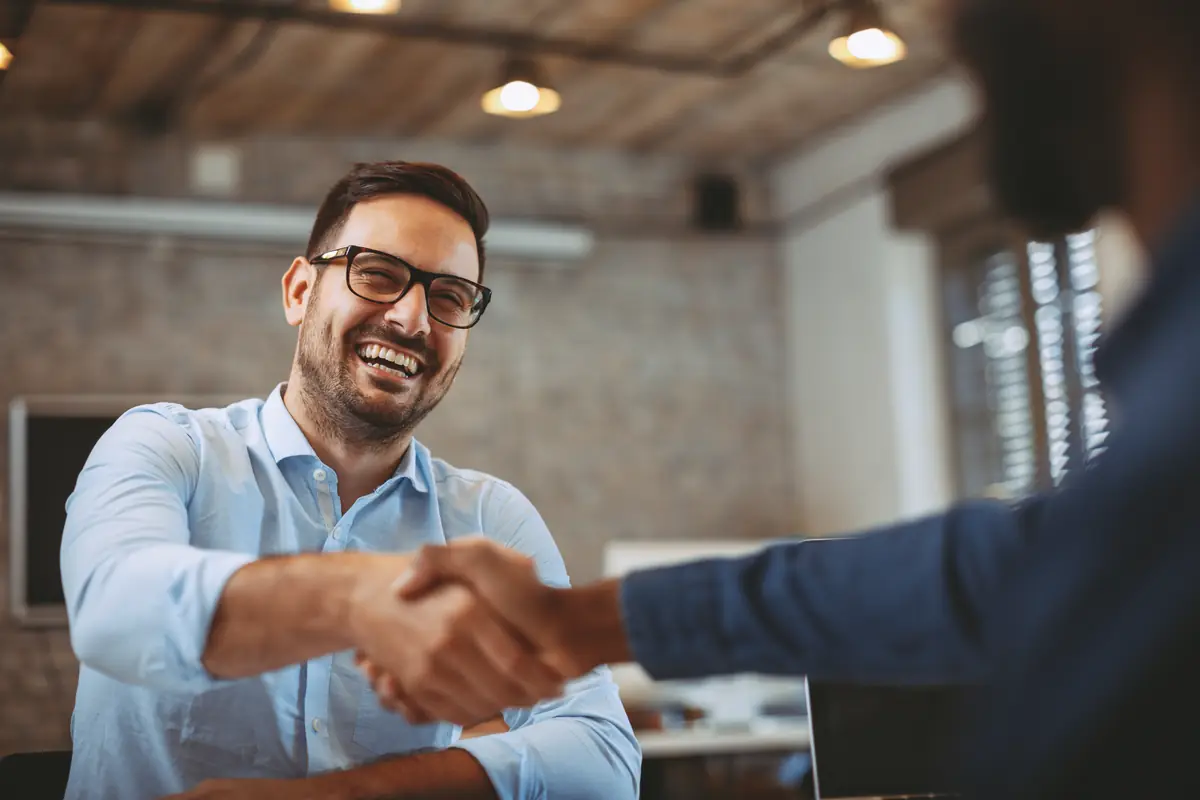 Two professionals shaking hands
