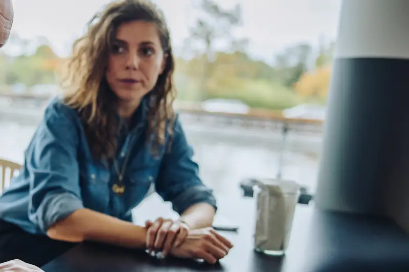 A woman listening closely in a meeting
