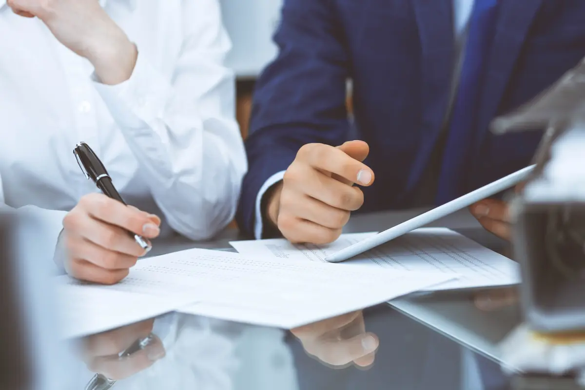 A document being signed at a desk