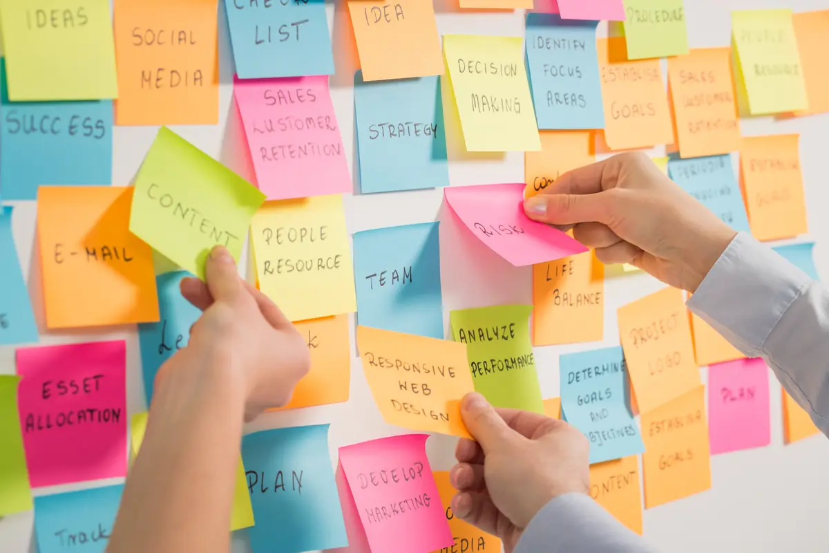 A board covered in sticky notes during a planning session